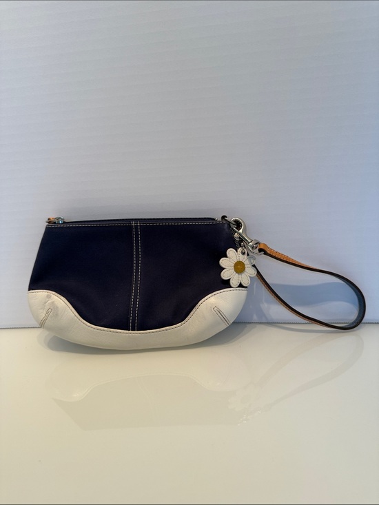 Coach Handbags - Coach Navy and White Wristlet with Daisy Charm